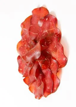 Dried thick sliced beef jerky on white Stock Photos