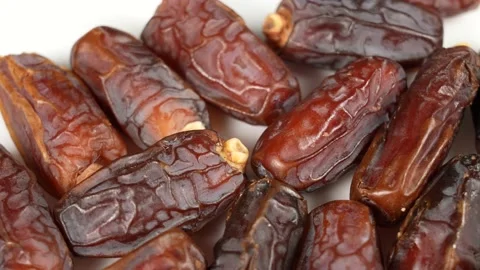Dried turkish dates isolated on white plate background Stock Footage 238992624