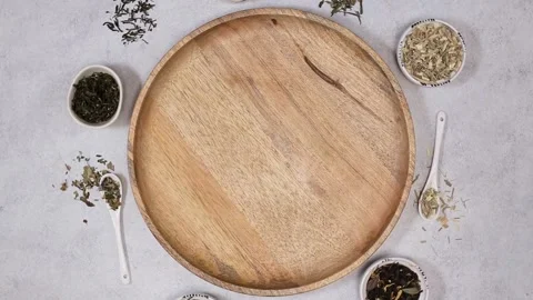 Dried various kinds of tea and wooden tray. White stone background with copy Stock Footage 204158844