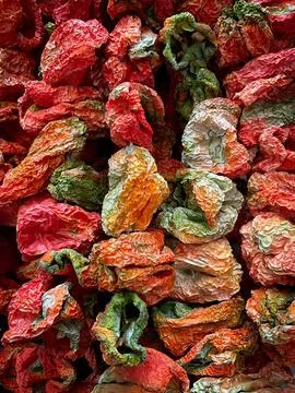 Dried vegetables, tomatoes, eggplant on a string. Turkish market Stock Photos