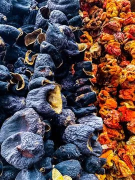 Dried vegetables, tomatoes, eggplant on a string. Turkish market Stock Photos