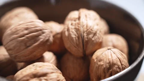 Dried walnuts falling in slow motion. Whole nuts Stock Footage 330420771