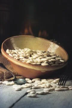 Dried white Beans on a table in a warm kitchen Stock Photos