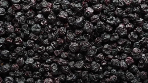 Dried wild blueberries background, rotates. Pile dry blueberry from dehydrator Stock Footage 331878860