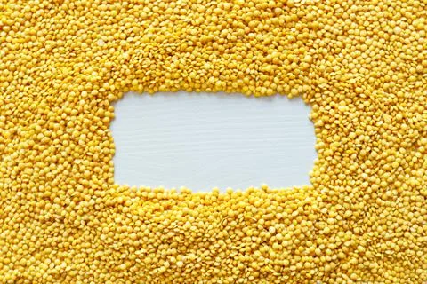 Dried yellow Split Lentils background. Stock Photos