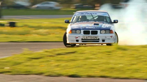 Race Car Drifting on Road through Forest · Free Stock Photo