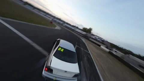 Drift car from FPV drone slow motion Stock Footage 254068858