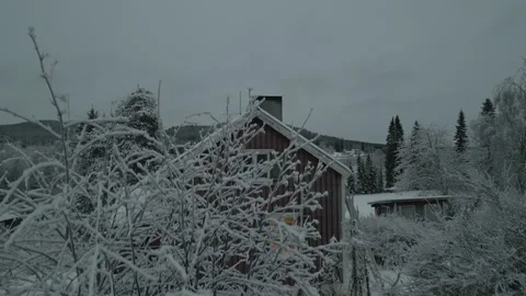 Drift up over house to reveal snow covered field and frozen lake Stock Footage 321698053