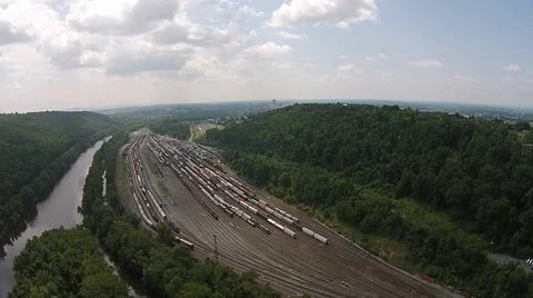 Drift over Rail Yard and River Stock Footage 40682933