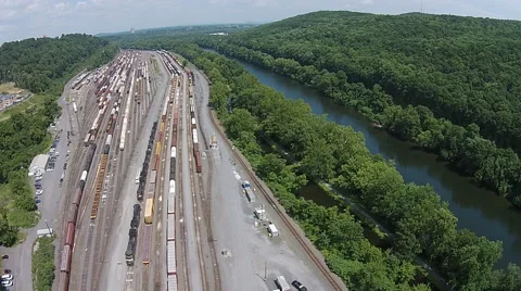 Drift over Rail Yard and River Stock Footage 40683191