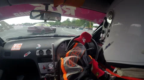 Drift racing outdoors, view of the car cabin Stock Footage