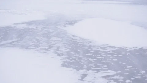 Drift snow on ice in winter blown by heavy wind Stock Footage 88522267