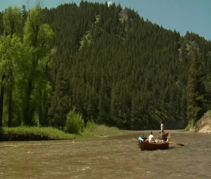 Driftboat in River with mountains 2 Stock Footage 21620454