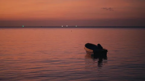Drifting boat on a sunset Stock Footage 127984768