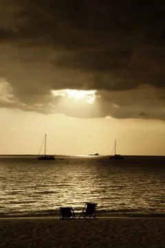 Drifting boat on a sunset Stock Photos