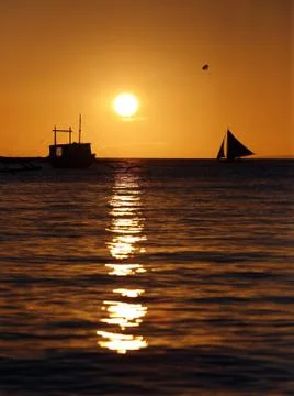 Drifting boat on a sunset Stock Photos