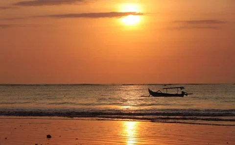 Drifting boat on a sunset Stock Photos