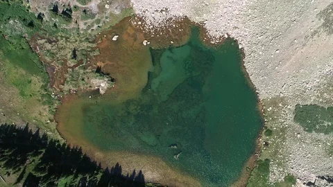 Drifting down to a mountain lake Stock Footage 94979283