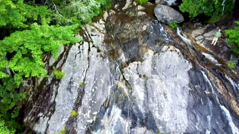 Drifting down over cascading waterfall Stock Footage 158323784