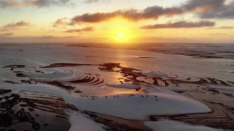 Drifting Over Reflective Sunset Water Channels at Lençóis Maranhenses Stock Footage 342444957