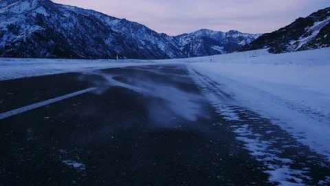 Drifting snow on the road in mountains walking shot Stock-Footage 72634866