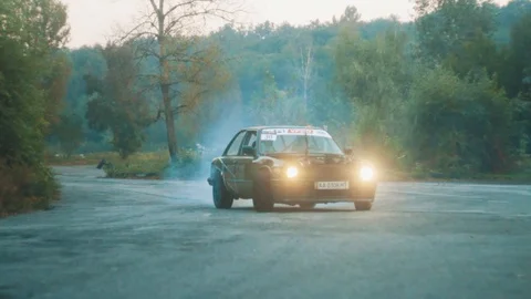 Drifting training and burning tires on track with powerful car Stock Footage 98230153