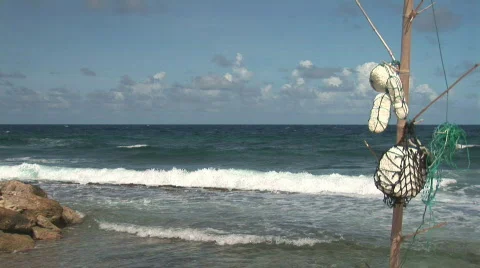 Driftwood with floaters on a pole Stock Footage 92203