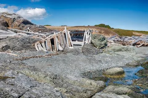 Driftwood House On The Beach Stock Photos