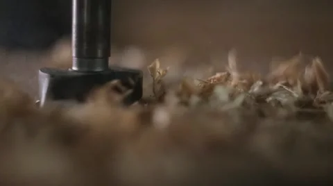Drill bit boring a hole in piece of wood with handheld power tool Stock Footage 59939481