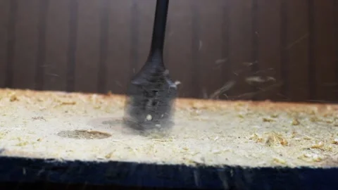 Drill Bit Cuts Hole in Board Video stock 147092049