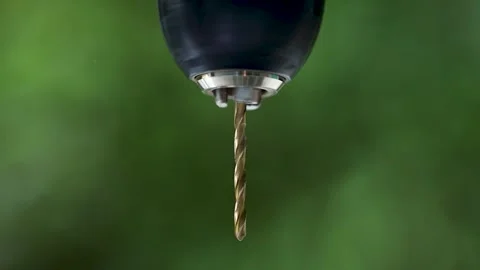 Drill bit in drill spin close-up, natural background Stock Footage 244935977