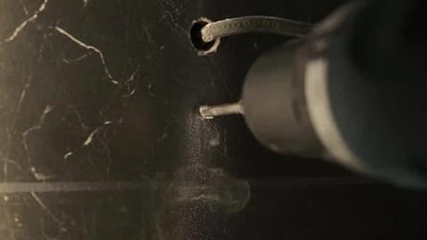 Drill bit drilling into ceramic tile. Professional drill tool for repair work Stock Footage 247062081