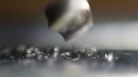The drill bit is drilling a hole in metal Stock Footage 60592025