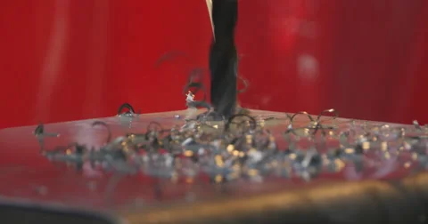 Drill bit drilling through Metal Plate2 Stock Footage 49940374