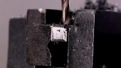 Drill bit of the machine cutting through metal Stock Footage 305172692