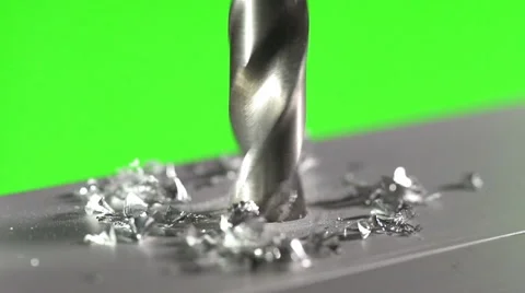 The drill bit make a hole in the aluminium surface on a green background Vídeos de archivo 61260017
