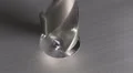 The drill bit make a hole in aluminum surface. Real time capture HD Footage