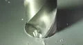 The drill bit make a hole in aluminum surface. Real time capture HD Footage