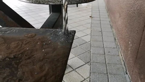 The drill bit is rotating to punch holes in the rusted iron plate. Stock Footage 121305193