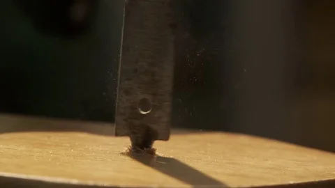Drill bit spinning in slow motion with dust and sawdust when drilling hole Stock Footage 76891953