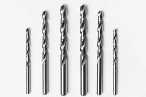 Drill bits of different sizes isolated over white backgr Fotos de archivo