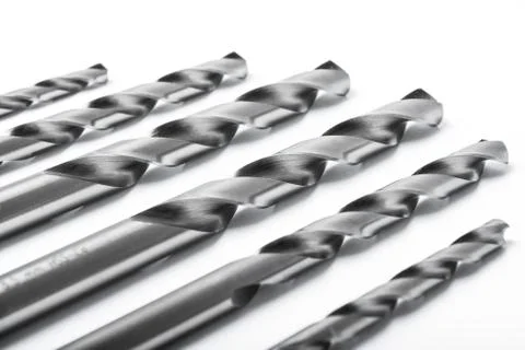 Drill bits of different sizes isolated over white backgr Fotos de archivo