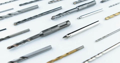 Drill bits of different sizes over white background Video stock 107160330