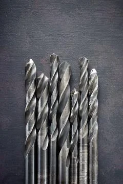 Drill bits for wall drilling black table Stock Photos