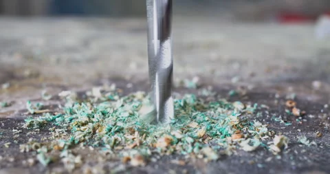 Drill breaks through chipboard close-up Stock Footage 303626046