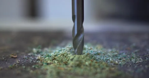 Drill breaks through chipboard close-up Stock Footage 309124839