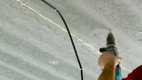 Drill the ceiling with a door. Selective focus. Stock Footage 152127722