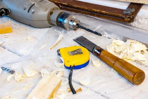 Drill, chisel, measuring tape Stock Photos