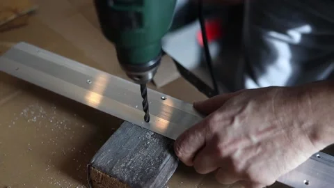 Drill close-up. The master drills holes in the metal panel. Stock Footage 197445158