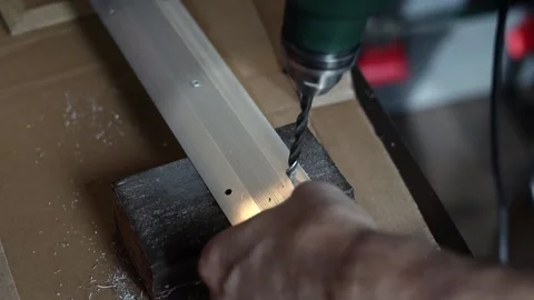 Drill close-up. The master drills holes in the metal panel. Stock Footage 197445160